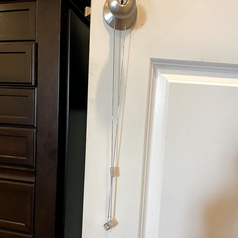 36 inch silver tone lariat necklace. Never worn.